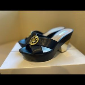 Guess black and gold platforms